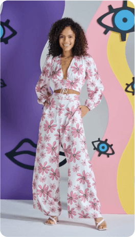 A person standing in front of a wall of art